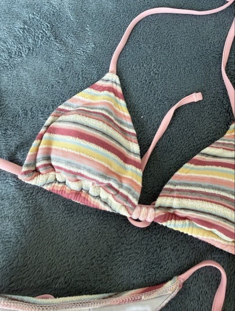 SHEIN Striped Bikini Set (Category: Bikinis & Swimsuits) located in Quezon City. Submitted by japfoodl0ver (Listing ID 1466439880, Image 2). Description: - Brand: SHEIN - Size: XS (tag attached) - Set includes: Triangle top, side-tie bottoms, and matching shorts - Details: Multi-colored stripes, pink straps, and cute bead accents on strings - Condition: Used once - Bought from another carouseller, pics are from her - Price is firm.