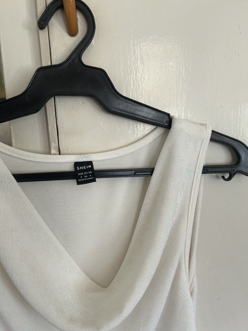 Shein White Cowl Neck Sleeveless Top (Category: Sleeveless) located in Quezon City. Submitted by onthehanger_ph (Listing ID 1466366856, Image 2). Description: White sleeveless top Cowl neck design with a textured fabric. Round neckline at the back Simple and easy to style with jeans or skirts.
