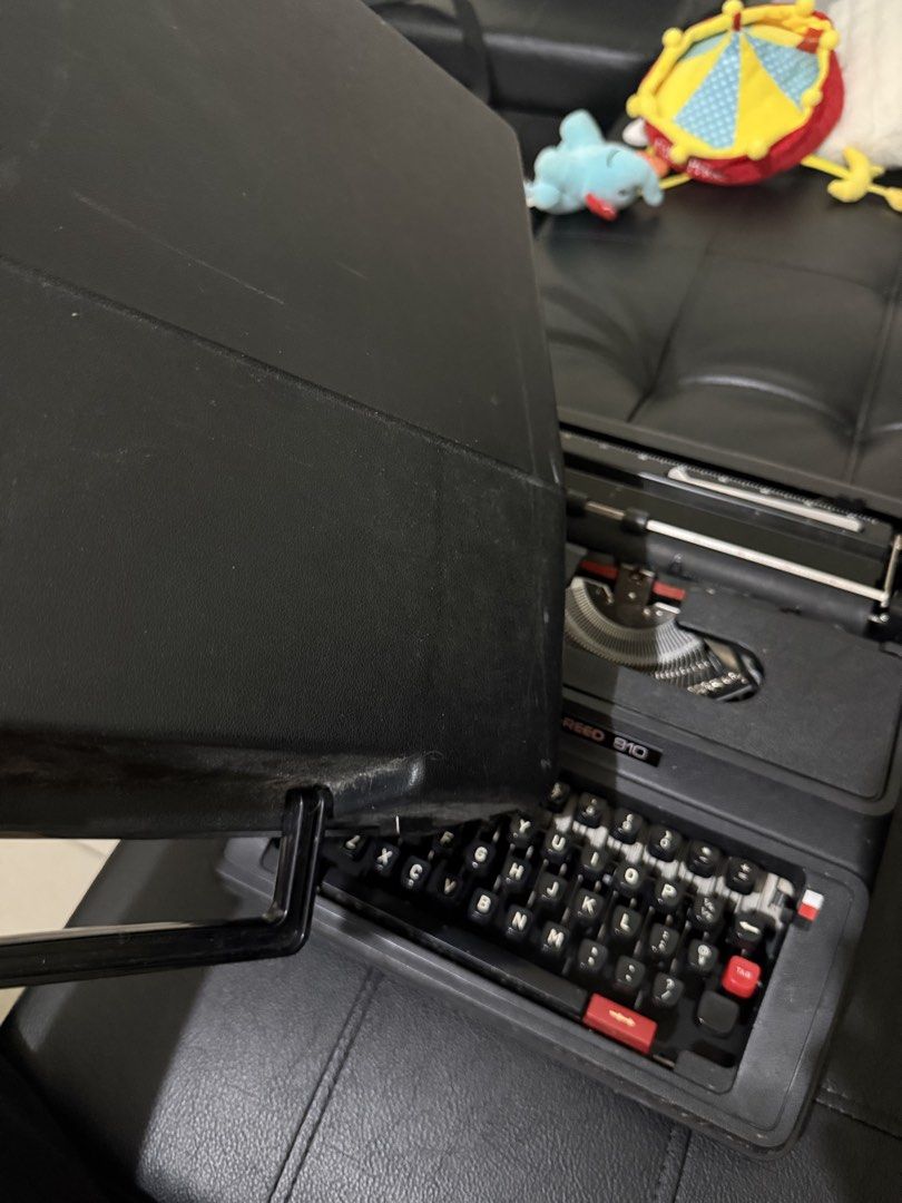 Silver-Reed 810 Portable Typewriter (Category: Office & Business Technology) located in Taguig. Submitted by baghabitmnl (Listing ID 1466477336, Image 3). Description: - Brand/Model: Silver-Reed 810 Manual Typewriter - Color: Classic black with white lettering - Keyboard: Standard QWERTY layout - Condition: Fully functional, well-maintained mechanical parts - Inclusions: Matching black hard protective case with carrying handle - Perfect for: Crea