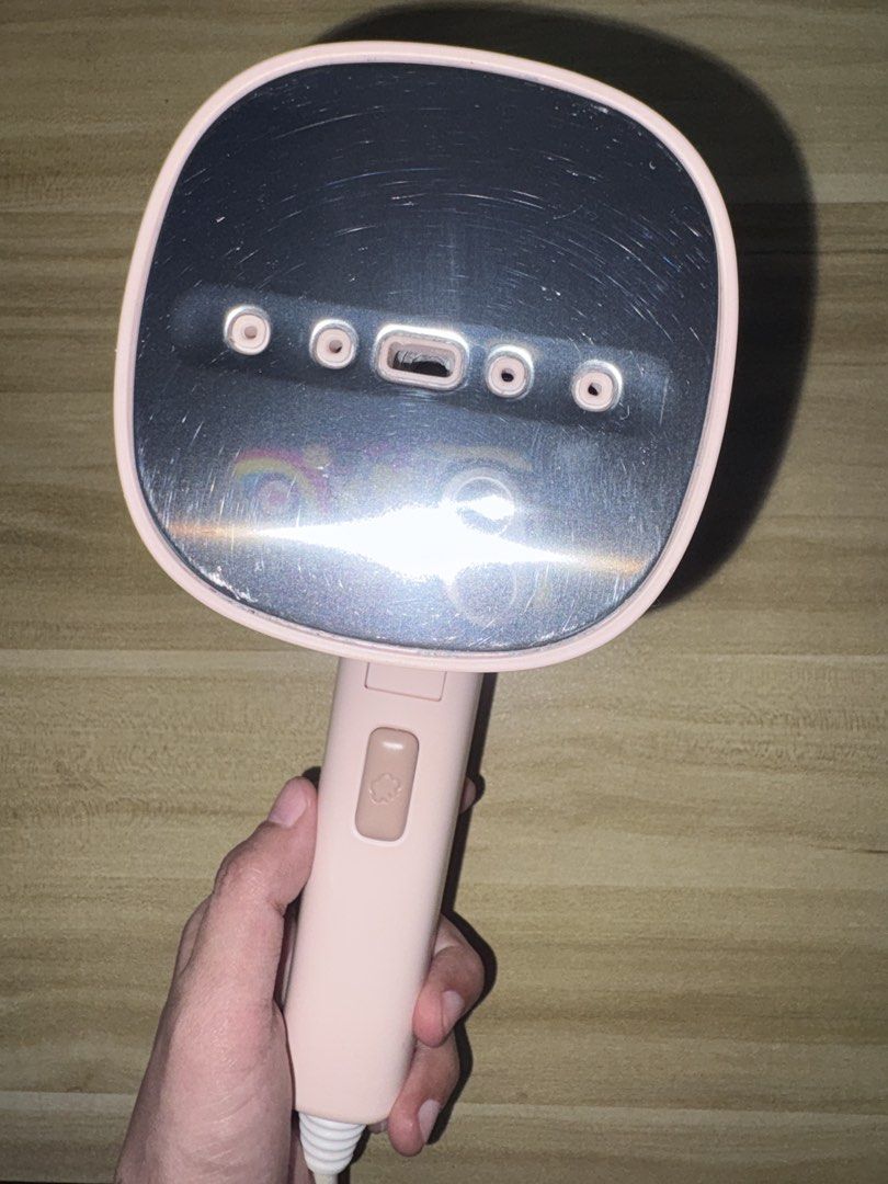 Simplus Handheld Garment Steamer Pink (Category: Irons & Steamers) located in Pasig City. Submitted by petite_declutter (Listing ID 1466420470, Image 1). Description: - Brand: Simplus - Type: Handheld Garment Steamer - Color: Aesthetic pastel pink - Condition: Works well, heats up fast - Features: Compact design, detachable rear water tank, multi-vent steam nozzle, and simple single-button trigger - Power: Corded electric with standard plug - Bes