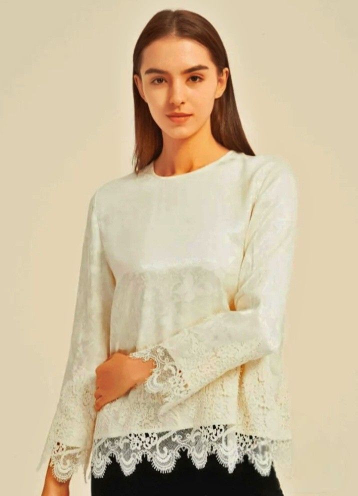 SIONE Moonlit Lace Silk Top (Category: Blouses) located in Cabanatuan. Submitted by miss.maia (Listing ID 1466551761, Image 1). Description: DESCRIPTION Round neckline with back button closure Long sleeves with lace-trimmed cuffs Scalloped lace hemline for a refined touch Relaxed fit for comfort and movement Fabric: mulberry silk Silk quiet glow meets lace’s gentle whisper — elegance in every detail..