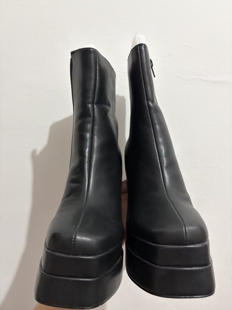Size 7.5 Black Chunky Platform Heel Boots (Category: Boots) located in General Trias. Submitted by hayami.clo (Listing ID 1466370342, Image 2). Description: - Style: Black chunky platform boots with block heels and trendy square toes - Closure: Inner side zipper for easy wear - Material: Smooth faux leather with a tall shaft design - Comfort & Height: Heavy soles for great height and stable walking - Condition: Brand new.