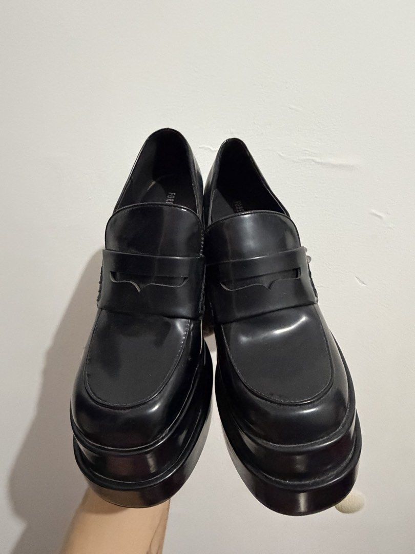 Size 8 - Forever 21 Black Chunky Platform Loafers (Category: Loafers) located in General Trias. Submitted by hayami.clo (Listing ID 1466369992, Image 1). Description: - Brand: Forever 21 SIZE 8 - Style: Black chunky platform loafers with high block heel and thick layered sole - Design: Slip-on with a classic penny loafer strap - Finish: Glossy - Condition: NEW - Perfect for elevating your casual or edgy everyday outfits!.