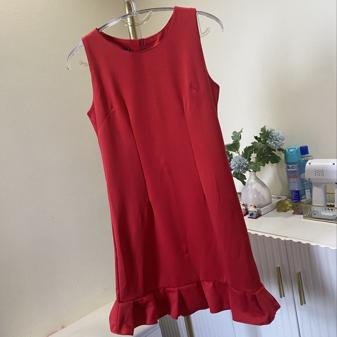 Small Red sleeveless mini dress with ruffled hem (Category: Dresses) located in Marikina City. Submitted by lovegoeson (Listing ID 1466426061, Image 1). Description: - Color: Bright red - Style: Sleeveless mini dress with round neckline and back zipper - Fit: Fitted bodice with vertical dart seams for a flattering shape - Detail: Playful ruffled hem at the bottom - Occasion: Perfect for dates, parties, or casual daytime outings.