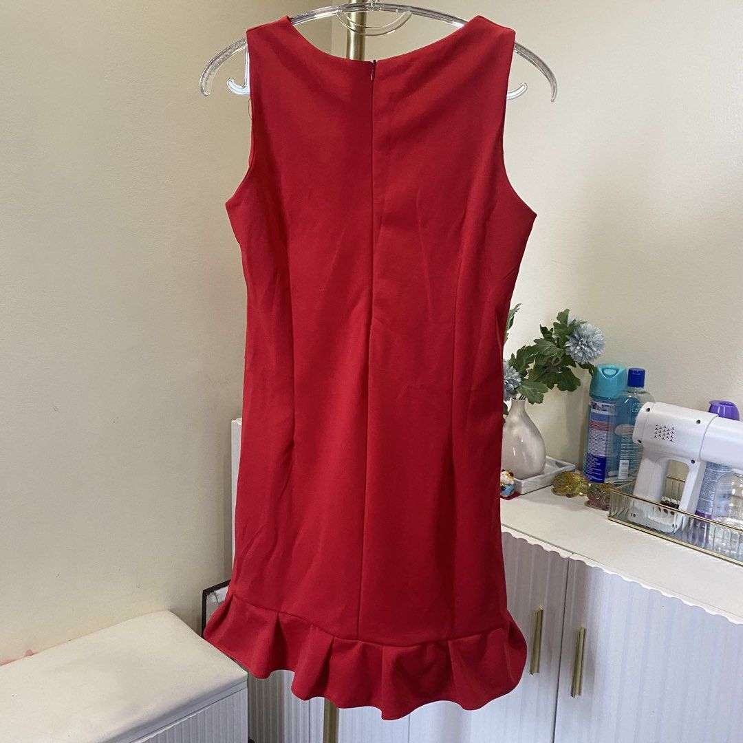 Small Red sleeveless mini dress with ruffled hem (Category: Dresses) located in Marikina City. Submitted by lovegoeson (Listing ID 1466426061, Image 2). Description: - Color: Bright red - Style: Sleeveless mini dress with round neckline and back zipper - Fit: Fitted bodice with vertical dart seams for a flattering shape - Detail: Playful ruffled hem at the bottom - Occasion: Perfect for dates, parties, or casual daytime outings.