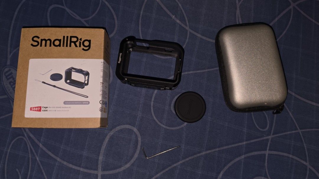 SmallRig Cage for DJI Osmo Action 6 (Category: Camera Bags & Carriers) located in Bulacan. Submitted by dandale17 (Listing ID 1466545775, Image 2). Description: - Compatible with: DJI Osmo Action 6 - Material: Full-cover metal cage for heavy-duty protection - Inclusions: Cage, lens cap, allen wrench tool - Extras: Original box and small grey carrying pouch included - Condition: all pieces accounted for, ready to mount.