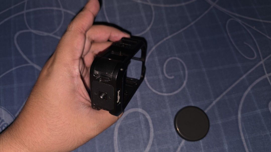 SmallRig Cage for DJI Osmo Action 6 (Category: Camera Bags & Carriers) located in Bulacan. Submitted by dandale17 (Listing ID 1466545775, Image 3). Description: - Compatible with: DJI Osmo Action 6 - Material: Full-cover metal cage for heavy-duty protection - Inclusions: Cage, lens cap, allen wrench tool - Extras: Original box and small grey carrying pouch included - Condition: all pieces accounted for, ready to mount.