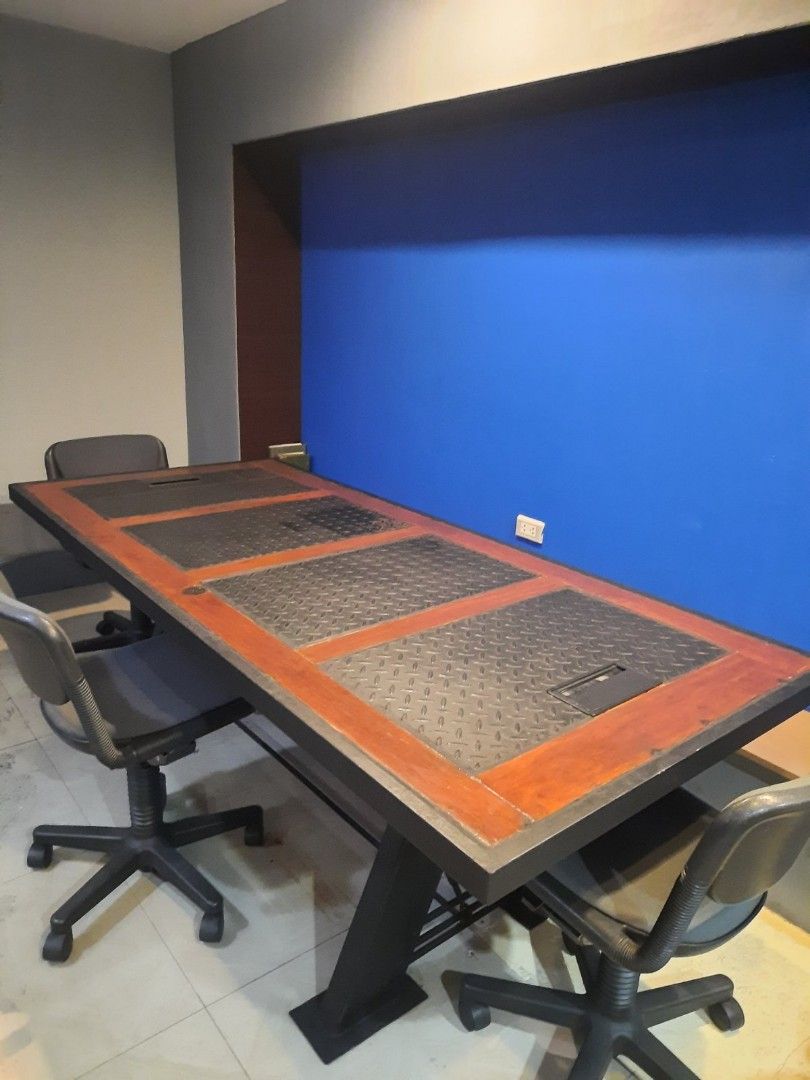 Solid Hardwood Conference Table (Category: Office Furniture & Fixtures) located in Quezon City. Submitted by McGyver23 (Listing ID 1466409704, Image 2). Description: Heavy Duty Conference Table 12k only! *Made of Antique Hardwood Door (Converted) *With very thick metal inlays and framing *Perfect for Industrial Cyberpunk Aesthetics Theme *With rectangular smart cable grommets *Metal legs and framing *Guaranteed Solid and Heavy * 8 chairs capacity