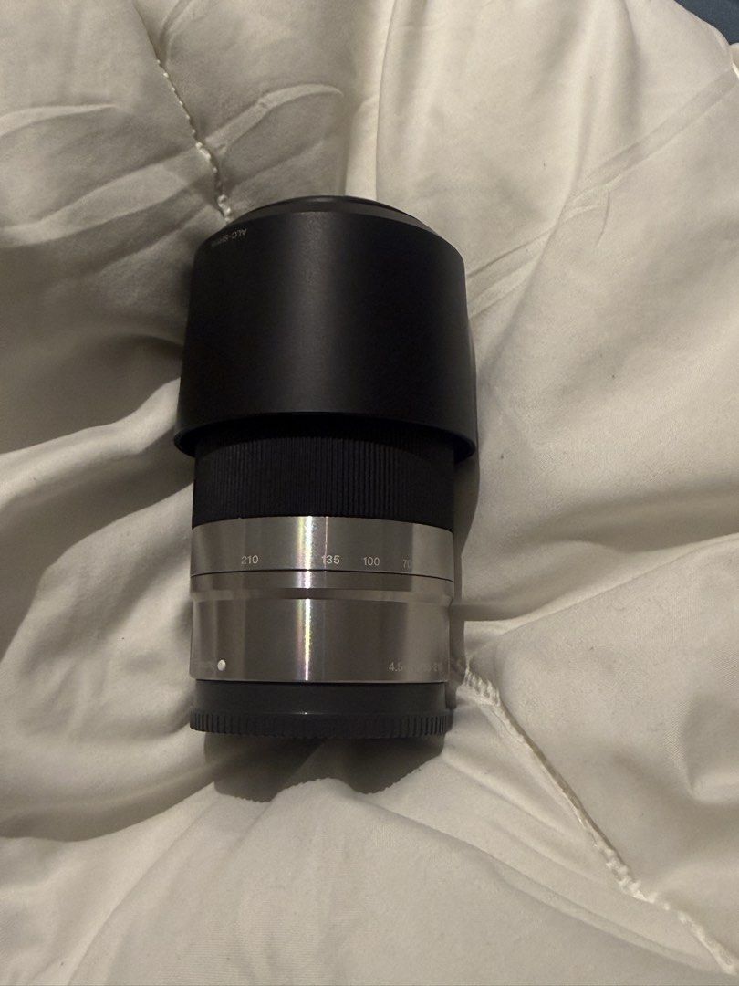 Sony A6000 Mirrorless Camera Bundle with Three Lenses (Category: Cameras) located in Manila. Submitted by pjaguilar436945 (Listing ID 1466506978, Image 2). Description: - Camera: Sony A6000 silver body with Peak Design anchor link on right strap lug - Lenses included: E 3.5-5.6/16-50mm OSS power zoom, and a silver telephoto zoom lens with hood - Modes: Standard PASM, memory recall, auto modes, and scene settings - Ideal for: Photo and video creat