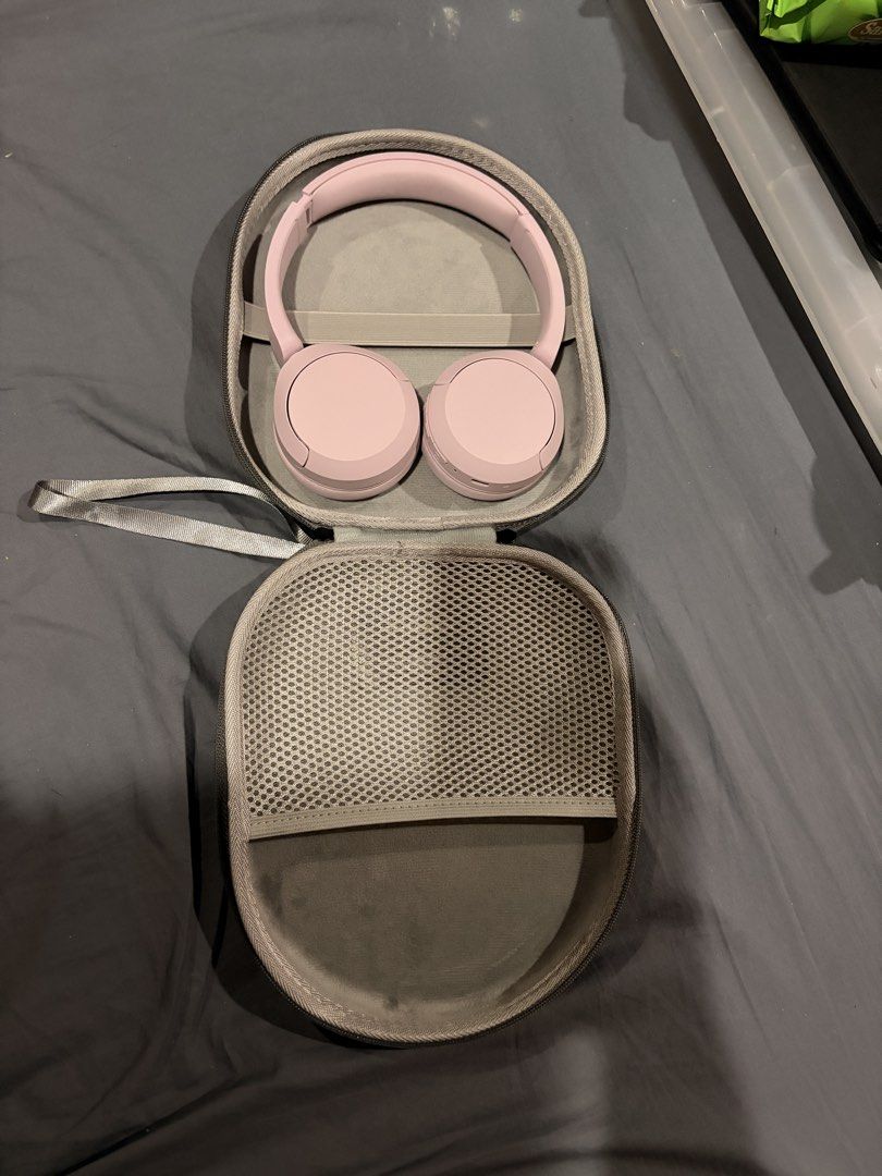 Sony WH-CH520 wireless headphones (pink) (Category: Headphones & Headsets) located in Marikina City. Submitted by nj1989 (Listing ID 1466476538, Image 2). Description: - Model: Sony wireless headphones - Color: Pastel pink with embossed branding - Design: Over-ear with soft leatherette ear cushions and adjustable headband - Performance: Great sound quality and long battery life - Condition: Clean, hardly used - Included: Matching grey hardshell z