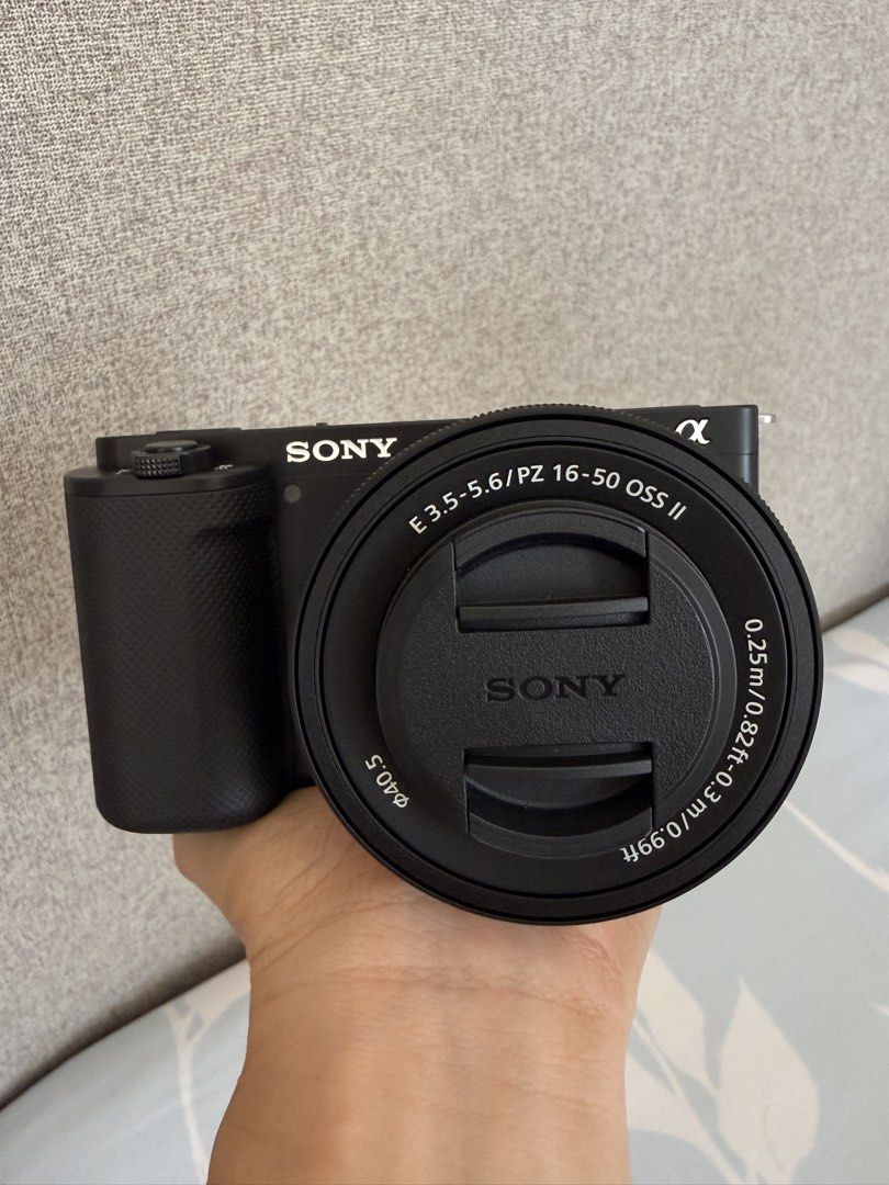 Sony ZV-E10 mirrorless camera with 16-50mm lens (Category: Cameras) located in Quezon City. Submitted by kaychisells (Listing ID 1466356936, Image 1). Description: FOR SALE: SONY ZV-E10 4K Good as new — no flaws, no scratches. Bought directly from Sony Physical Store last April for ₱45,800 and still under 12-month warranty. • Sony ZV-E10 Mirrorless Camera (Black) • E 3.5-5.6/PZ 16-50 OSS II Lens • 64GB Sony SF-E64A Memory Card • Original box, man