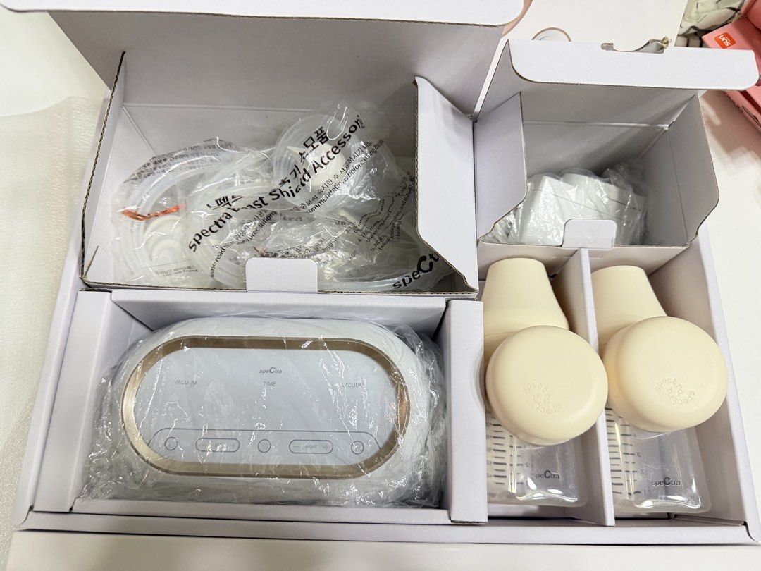 Spectra Dual Compact Electric Breast Pump (Preloved) (Category: Breastfeeding & Bottle Feeding) located in Taguig. Submitted by 4e_fam_finds (Listing ID 1466384112, Image 2). Description: - Model: Spectra Dual Compact double electric breast pump - Condition: Used Like new, used contents inside protective packaging with original box - Key Features: Dual motors, built-in rechargeable battery, back-flow protection, and built-in timer - Inclusions: P