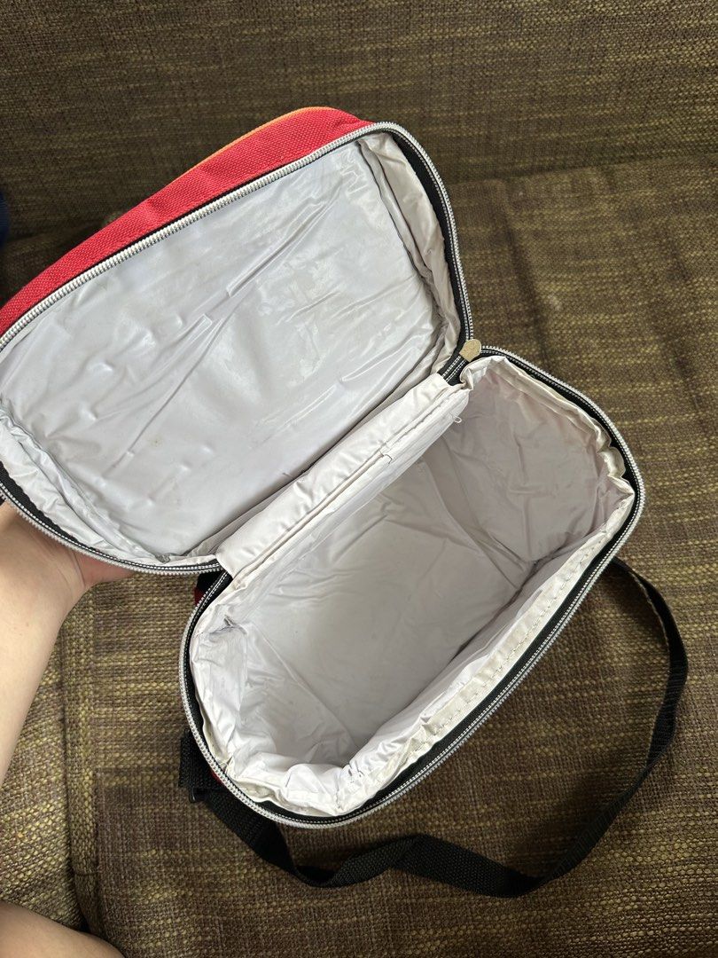 Speedy Racing Car Lunch Bag with Strap (Category: Tote Bags) located in Pasay City. Submitted by kimverlygo50697 (Listing ID 1466401135, Image 3). Description: - Design: Cool red and black with a racing car graphic and 'Speedy' text - Insulation: White insulated lining to keep food warm or cool - Storage: Side mesh pocket for water bottles or small items - Closure: Secure all-around zipper closure - Portability: Includes a sturdy top handle and a