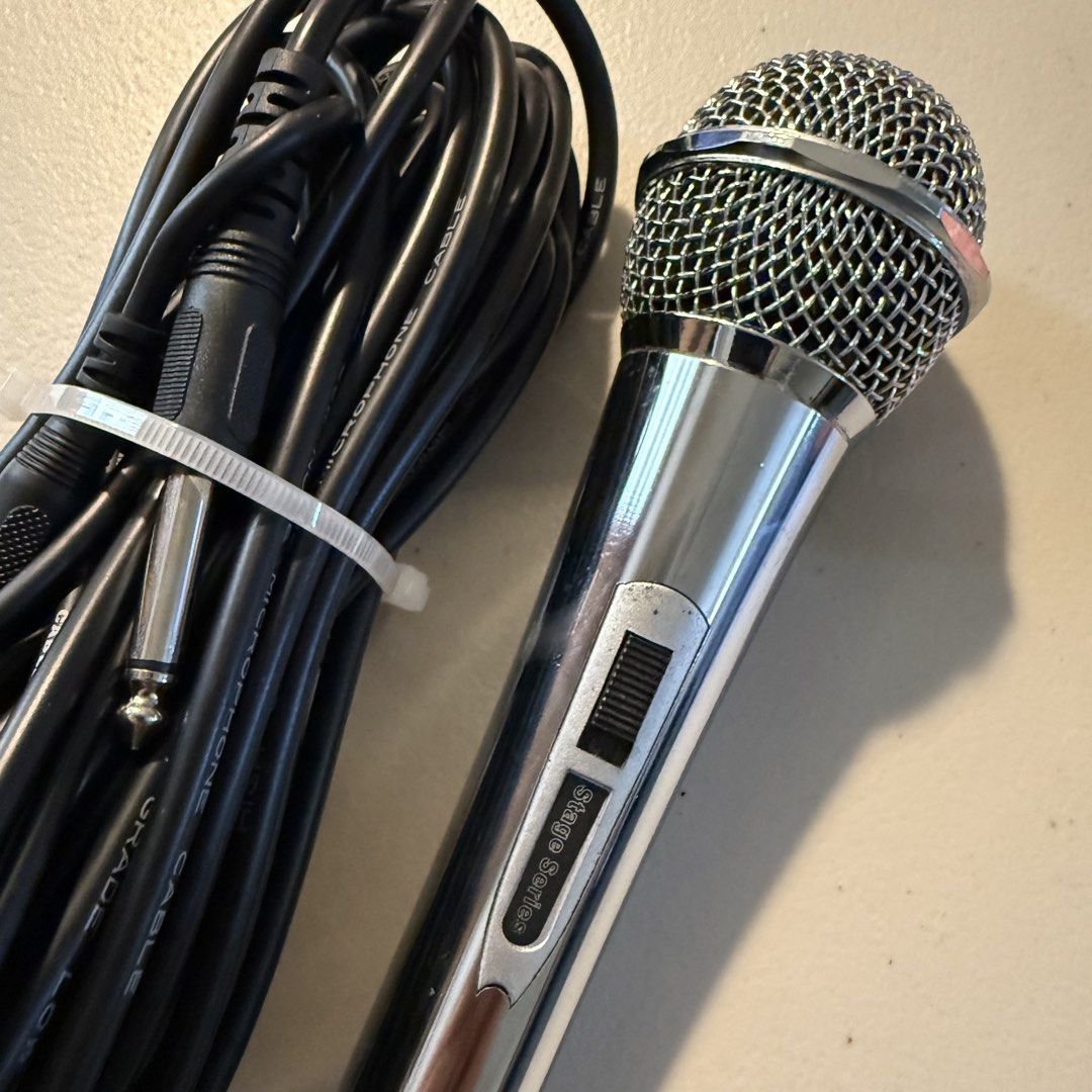 Stage Series Dynamic Microphone with Long Cable (Category: Microphones) located in Manila. Submitted by cheemkenn (Listing ID 1466414689, Image 1). Description: - good for karaokes - RFS: I bought a new microphone that is good for streaming - Model: Silver Stage Series Handheld Microphone - Condition: Clean and shiny grille, well-maintained - Control: Built-in on/off switch on the metal handle - Includes: Long black microphone cable with XLR and 