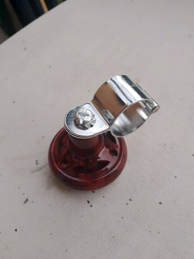 Steering Wheel Spinner Knob (Category: Steering, Brakes, Control Parts and Accessories) located in Rizal. Submitted by bargokarl (Listing ID 1466560267, Image 2). Description: **FOR SALE: Steering Wheel Spinner Knob (Power Handle / Spinner)** ₱100 **Condition:** Brand New **Details:** * Universal steering wheel spinner knob * Wood grain / amber design na may chrome clamp * Pambawas pagod sa pagmamaneho at pampadali sa pag-maneuver / pag-park * Ku