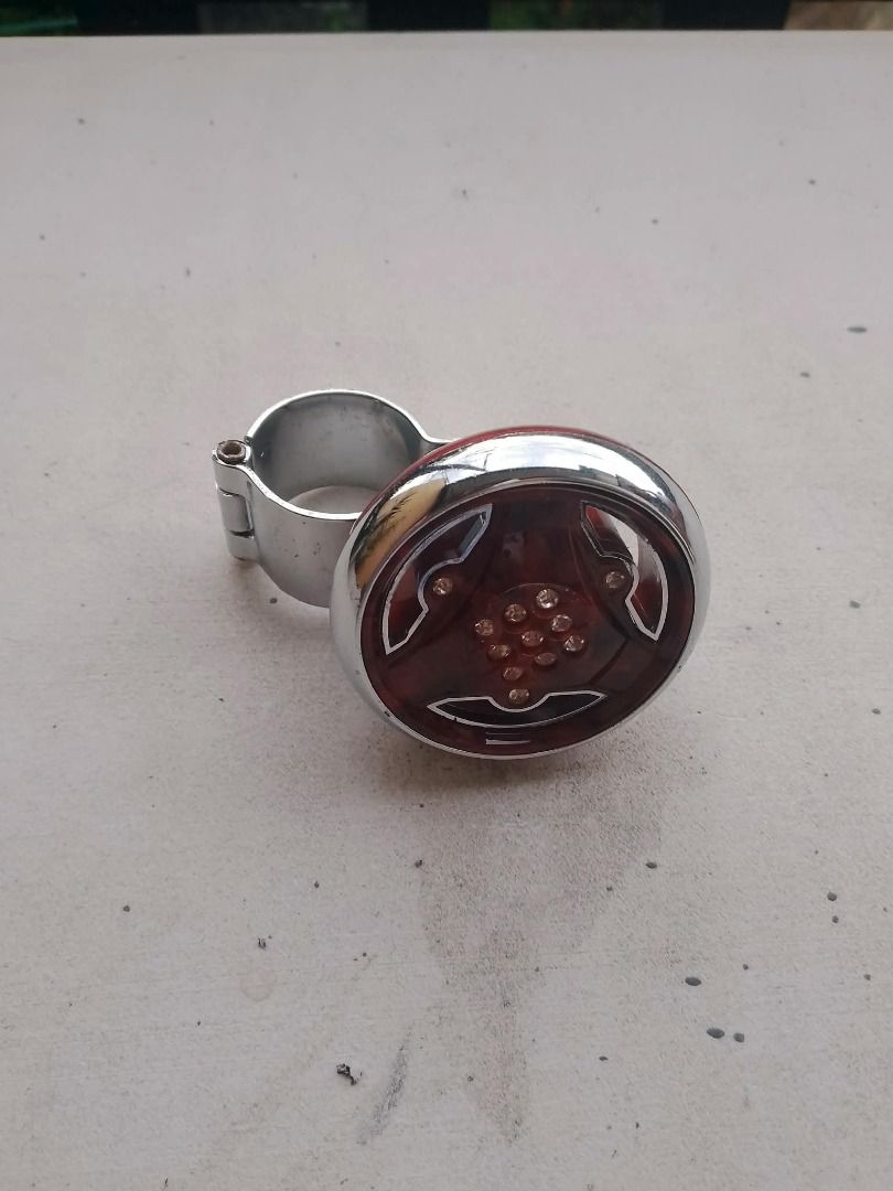 Steering Wheel Spinner Knob (Category: Steering, Brakes, Control Parts and Accessories) located in Rizal. Submitted by bargokarl (Listing ID 1466560267, Image 1). Description: **FOR SALE: Steering Wheel Spinner Knob (Power Handle / Spinner)** ₱100 **Condition:** Brand New **Details:** * Universal steering wheel spinner knob * Wood grain / amber design na may chrome clamp * Pambawas pagod sa pagmamaneho at pampadali sa pag-maneuver / pag-park * Ku