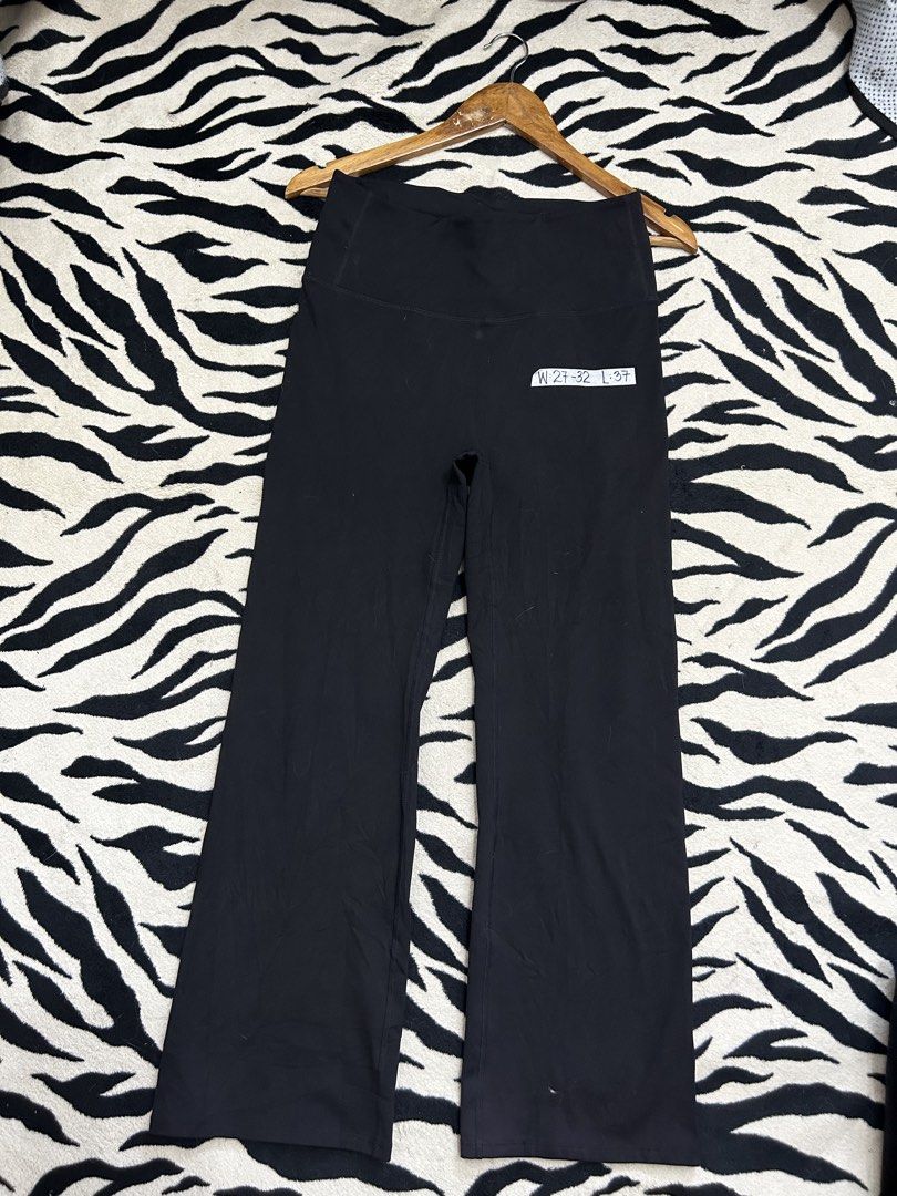 STL Black Activewear flare Pants (Category: Activewear) located in Valencia. Submitted by crizzagella20 (Listing ID 1466500557, Image 1). Description: - Brand: STL - Color: Solid black - Style: High waist with flare cut legs - Material: 85% polyester, 15% polyurethane (stretchy workout fabric) - Size/Fit: Fits waist 27 to 32 inches - Length: 37 inches - Note: Fabric label marked WL (CUT).