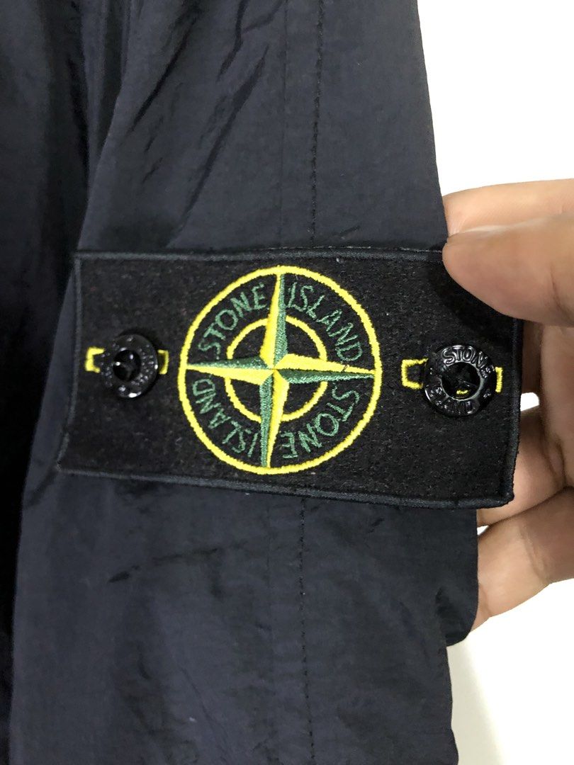 Stone Island Black Jacket Coat (Category: Coats, Jackets and Outerwear) located in Quezon City. Submitted by clarizedeo09960 (Listing ID 1466501885, Image 3). Description: - 100% Authentic Stone Island black jacket - Material: 100% premium cotton, made in Romania - Design: Full zip front with high collar and standard fit - Pockets: Dual angled zippered front pockets - Details: Signature compass logo patch on left sleeve, ribbed cuffs and hem - Au
