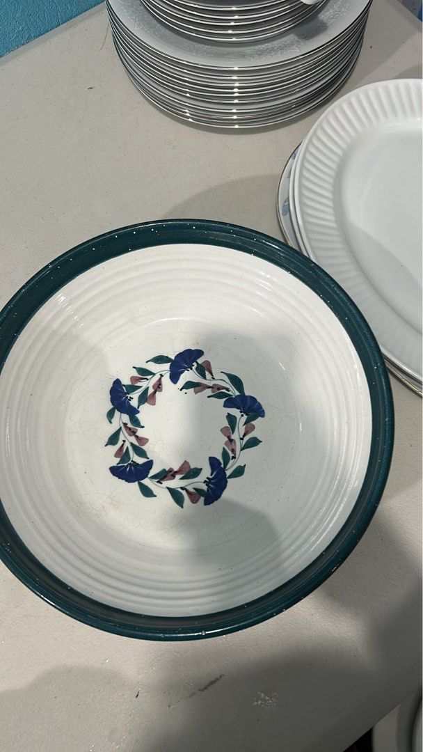 Stoneware Large Serving Bowl (Category: Dinnerware & Cutlery) located in San Fernando. Submitted by dcdaisyyy (Listing ID 1466477316, Image 1). Description: Beautiful, sturdy ceramic large serving bowl. Features a hand-painted dark green rim with matching floral and leaf illustrations on a white background. Perfect for family-sized pasta, salads, fruits, or as a kitchen centerpiece..