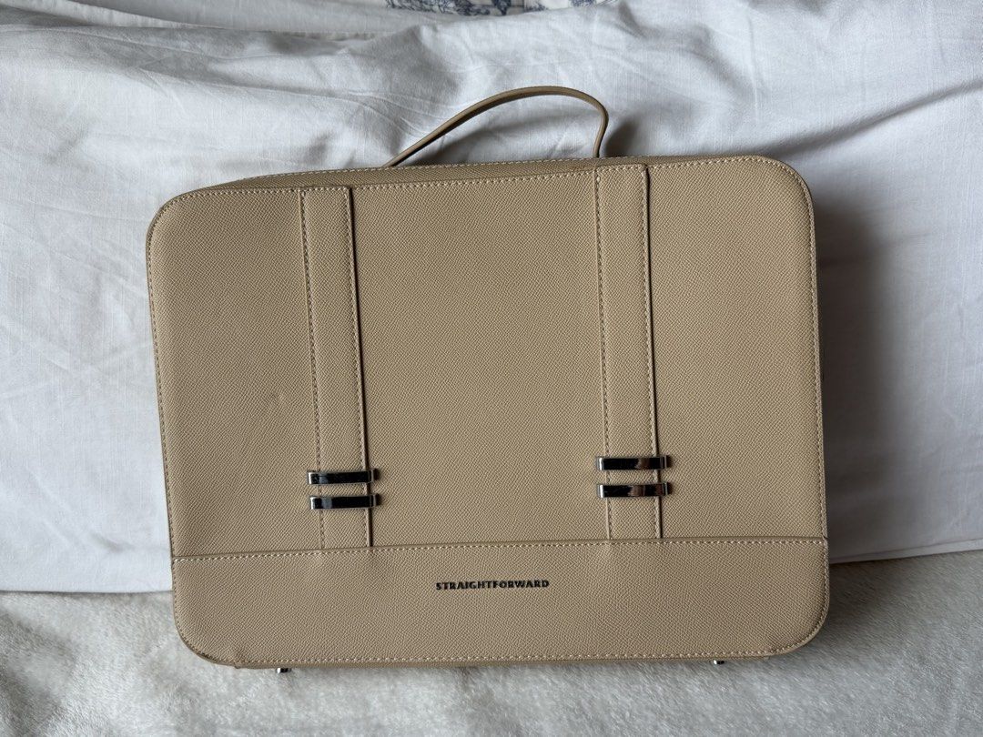 Straightforward Beige DVL Lusso Laptop Bag (Category: Laptop Bags & Sleeves) located in Manila. Submitted by jairahncle (Listing ID 1466395974, Image 3). Description: - Brand: Straightforward (Tag still attached) - Color: Elegant beige with silver hardware accents - Material/Texture: Saffiano-style finish - Closure: Full wrap-around zipper with top handle design - Interior: Includes a zippered pocket and open storage space for your laptop and ess