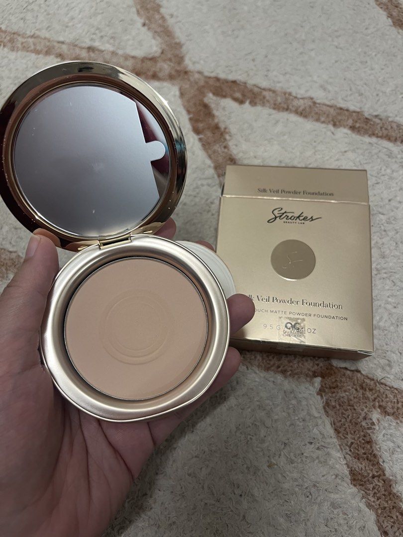Strokes Silk Veil Powder Foundation (Ecru) (Category: Makeup) located in Cagayan de Oro. Submitted by simplydecluttering_makeup (Listing ID 1466488791, Image 2). Description: - Product: Strokes Beauty Lab Silk Veil Powder Foundation - Shade: Ecru - Condition: Swatched once to check shade, basically untouched - Size: 9.5g / 0.34 oz - Inclusions: Original box, compact with mirror, and brand new unused puff applicator - Packaging: Premium gold ribbe