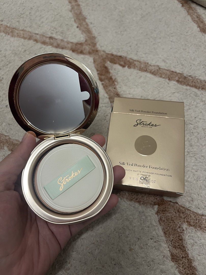 Strokes Silk Veil Powder Foundation (Ecru) (Category: Makeup) located in Cagayan de Oro. Submitted by simplydecluttering_makeup (Listing ID 1466488791, Image 3). Description: - Product: Strokes Beauty Lab Silk Veil Powder Foundation - Shade: Ecru - Condition: Swatched once to check shade, basically untouched - Size: 9.5g / 0.34 oz - Inclusions: Original box, compact with mirror, and brand new unused puff applicator - Packaging: Premium gold ribbe