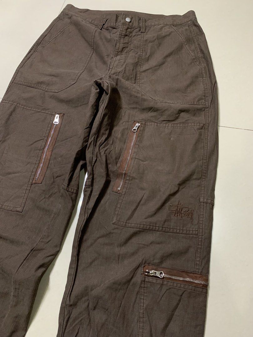 Stüssy Pigment Dyed Ripstop Flight Pants (Category: Chinos) located in Molave. Submitted by mysticbird_38213e (Listing ID 1466501388, Image 3). Description: Good condition Rare piece Ganda nito Working all zipper 8 POCKETS embroided logo Choco brown , good fade Angas nito boss DIMENSIONS : 30 on tag best fit 33 - 34 43 length 9.5 hem.