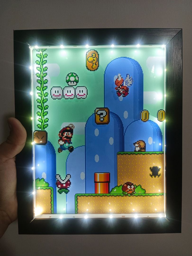 Super Mario World 3 Video Game Shadow Box (Category: Nintendo) located in Quezon City. Submitted by natzuki10 (Listing ID 1466359207, Image 2). Description: Super Mario World 3 Video Game Shadow Box Height: 10 inches Width: 8 inches 750 w/o lights 920 w/ lights *Handmade Pixel Shadow Boxes *Accepting Customized Designs *Perfect for Gamers & Collectors #videogames #roomdecor #collection #gamer #gift #supermario .