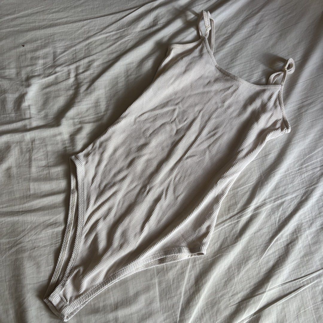 Supre Cream Ribbed Bodysuit Top (Category: Sleeveless) located in Binan City. Submitted by myprelovedhaul (Listing ID 1466397547, Image 1). Description: - fits xs to small! - no when worn photos! - last price posted! - please message only if sure buyer! - limited replies only. - Available unless mark as sold. - Ship via j&t or lalamove for same day. -Mode of payment: Gcash 📍Biñan Laguna .