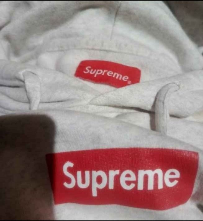 Supreme Box Logo Hooded Sweatshirt Grey (Category: Hoodies) located in Cavite. Submitted by marvzclothing (Listing ID 1466427731, Image 3). Description: - Brand: Supreme - Color: Grey with classic red box logo - Material: 100% cotton, Made in Peru - Features: Drawstring hood, front kangaroo pocket, ribbed cuffs and hem - Care: Hand wash cold recommended - Condition: Clean and ready to wear.