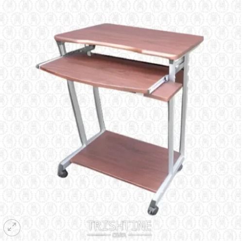 TCOM-023 | Computer Table with Tray & CPU Bin (Category: Office Furniture & Fixtures) located in Caloocan City. Submitted by jim.trishtineofficefurnitures (Listing ID 1466435682, Image 1). Description: - Compact rolling computer cart with a warm wood finish and sturdy silver metal frame - Smooth-gliding caster wheels for easy mobility around the room - Built-in sliding keyboard tray to save desk space - Lower shelf ideal for a CPU tower, storage 
