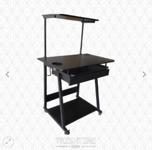 TCOM-026 | Computer Table with USB Socket, Headphone & Bottle Holder (Category: Office Furniture & Fixtures) located in Caloocan City. Submitted by jim.trishtineofficefurnitures (Listing ID 1466434202, Image 1). Description: - Sturdy black rolling computer cart built for heavy-duty home or office use - Main desktop includes two convenient built-in cup holders - Smooth pull-out keyboard tray for easy typing access - Upper top shelf perfect for a p