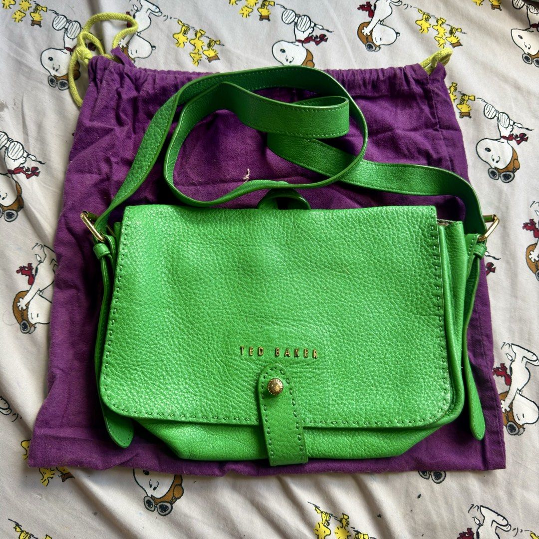Ted Baker Markun Stab Stitch Cross Body Bag (Category: Cross-body Bags) located in Marikina City. Submitted by preloved_n_reloved (Listing ID 1466359143, Image 1). Description: - Brand: Ted Baker - Style: Crossbody bag - Color: Bright green / forest green leather with gold-tone hardware - Closure: Secure magnetic snap - Interior: Black and white floral fabric lining with a convenient zipped pocket - Inclusions: Original purple Ted Baker dust bag.