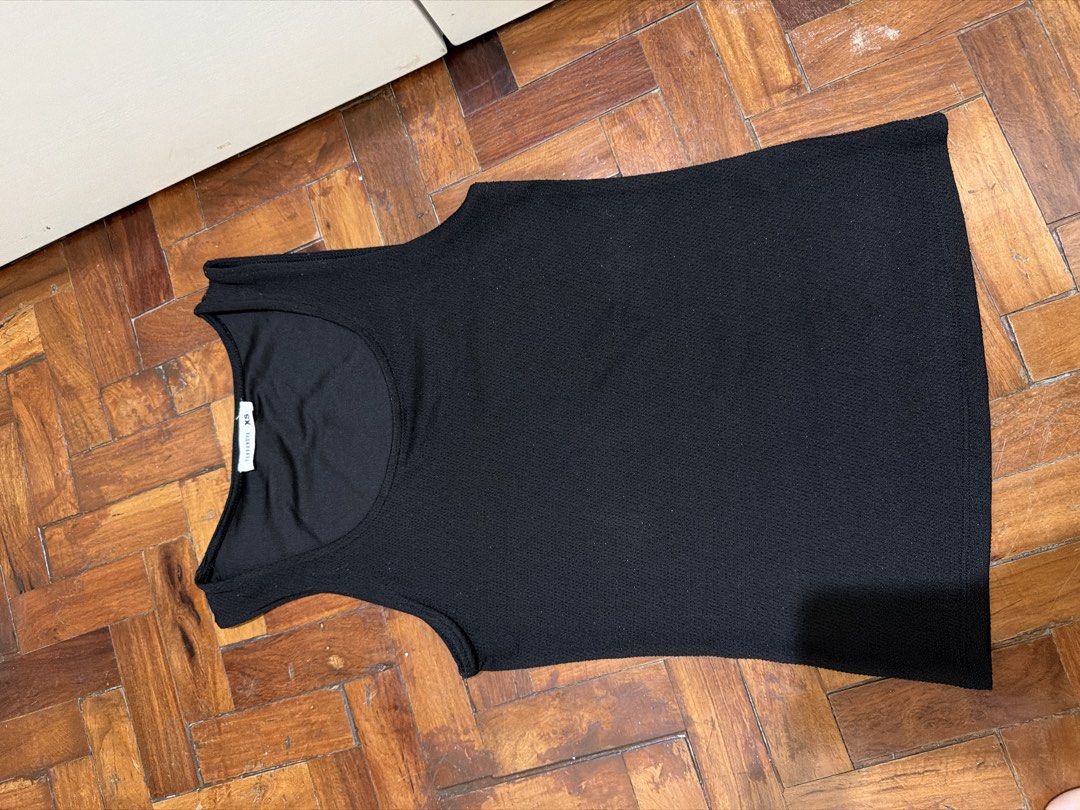 Terranova Black Tank Top XS (Category: Sleeveless) located in Manila. Submitted by wearagainfinds (Listing ID 1466410536, Image 1). Description: - Brand: Terranova - Size: can fit to S - XS - Color: Black with subtle sparkly bits - Material: Textured fabric - Neckline: Scoop neck - Condition: Great basic piece for layering or wearing solo - Home: Smoke-free - Note: Pit-to-pit and length measurements available upon request.