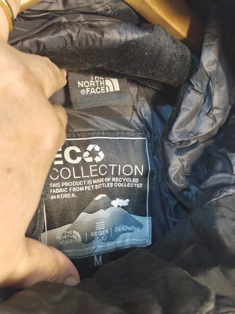 THE NORTH FACE POLAR AIR DOWN JACKET - THE NORTH FACE JACKET (Category: Coats, Jackets and Outerwear) located in Morong. Submitted by katiesmodernthrift (Listing ID 1466519318, Image 3). Description: The North Face Polar Air Down Jacket (or similar Eco Air/Polar Air series featuring multi-pocket utility design and the "NEVER STOP EXPLORING" chest label). 🛡️ Authenticity Check: Authentic Several key details confirm this is a real product: The Hol