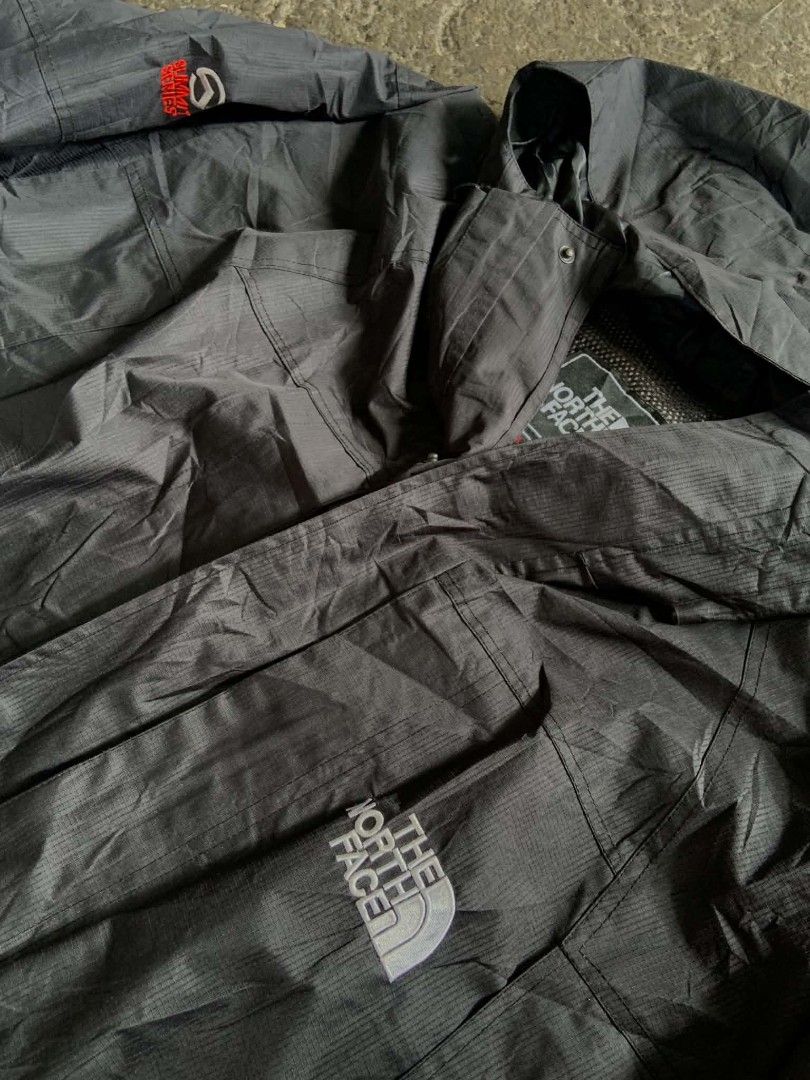 The North Face Summit Series Black Waterproof Jacket (Category: Coats, Jackets and Outerwear) located in San Jose. Submitted by thriftsja (Listing ID 1466379519, Image 2). Description: - Authentic The North Face Summit Series waterproof jacket - Color: Black with embroidered logos on chest and shoulder - Features: Built-in hood, zip-up closure, and textured fabric - Comfort: Lightweight outer layer with interior mesh lining for breathability - Id