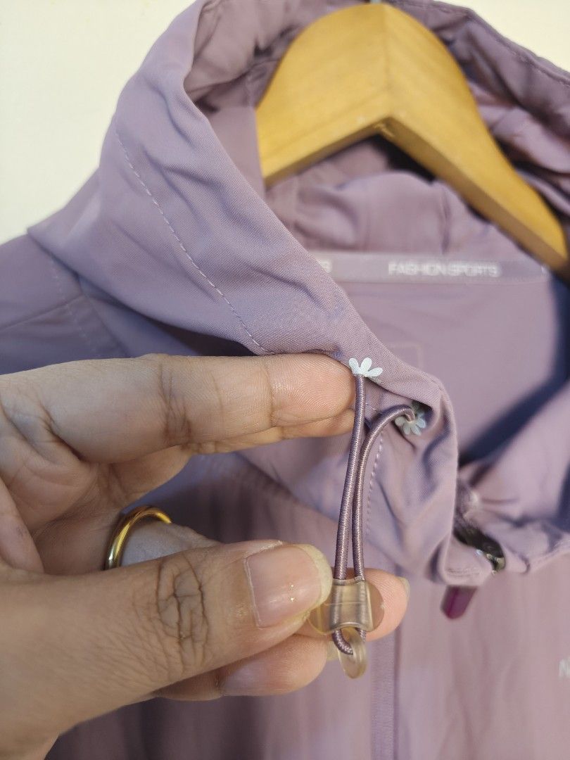 The North Face Inspired Lavender Two-Tone Windbreaker Jacket (Category: Coats, Jackets and Outerwear) located in Morong. Submitted by katiesmodernthrift (Listing ID 1466514192, Image 3). Description: Super cute color block patterns with a unique honeycomb sleeve detail. Great for sun protection or breezy weather. 📌 FEATURES: • Adjustable hood toggles • Functional side zipper pockets • Lightweight, breathable fabric 📐 ACTUAL MEASUREMENTS (Flat L