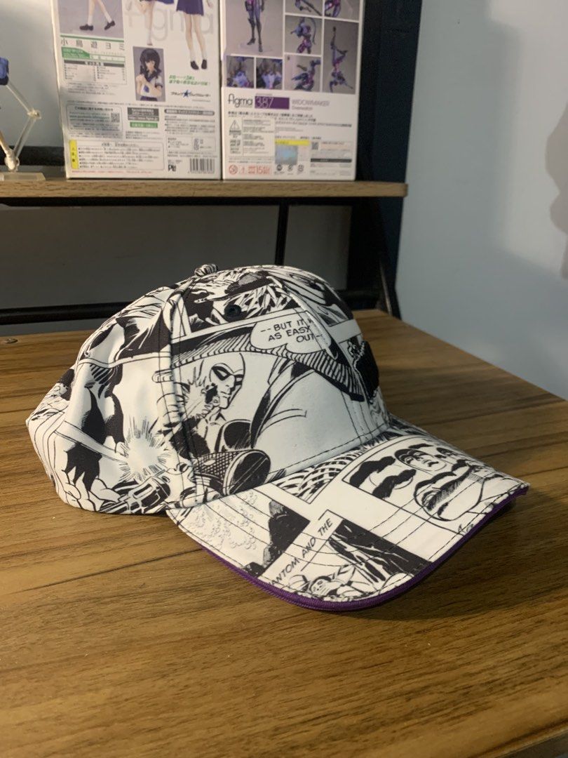 The Phantom Comic Book Print Baseball Cap (Category: Caps & Hats) located in Manila. Submitted by sellingmy.stuff (Listing ID 1466337048, Image 2). Description: - Authentic 2016 King Features Syndicate The Phantom merchandise - Eye-catching black and white comic book panel print across the entire cap - Embroidered The Phantom logo on the front panel - Stylish purple underside on the brim - Vibrant colorful comic panel inner lining - Adjustable st