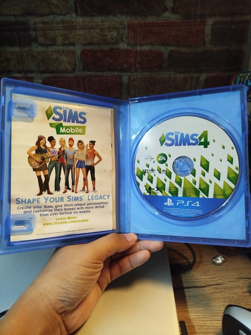 The Sims 4 PS4 Game (Category: PlayStation) located in Binan City. Submitted by pumpkiiin02 (Listing ID 1466489394, Image 3). Description: - Platform: PlayStation 4 (PS4) - Condition: Complete with original blue keep case, game disc, and insert booklet - Gameplay: Single-player life simulation - Authenticity: Region code and barcode clearly visible on the back cover - Mode: Offline single-player.