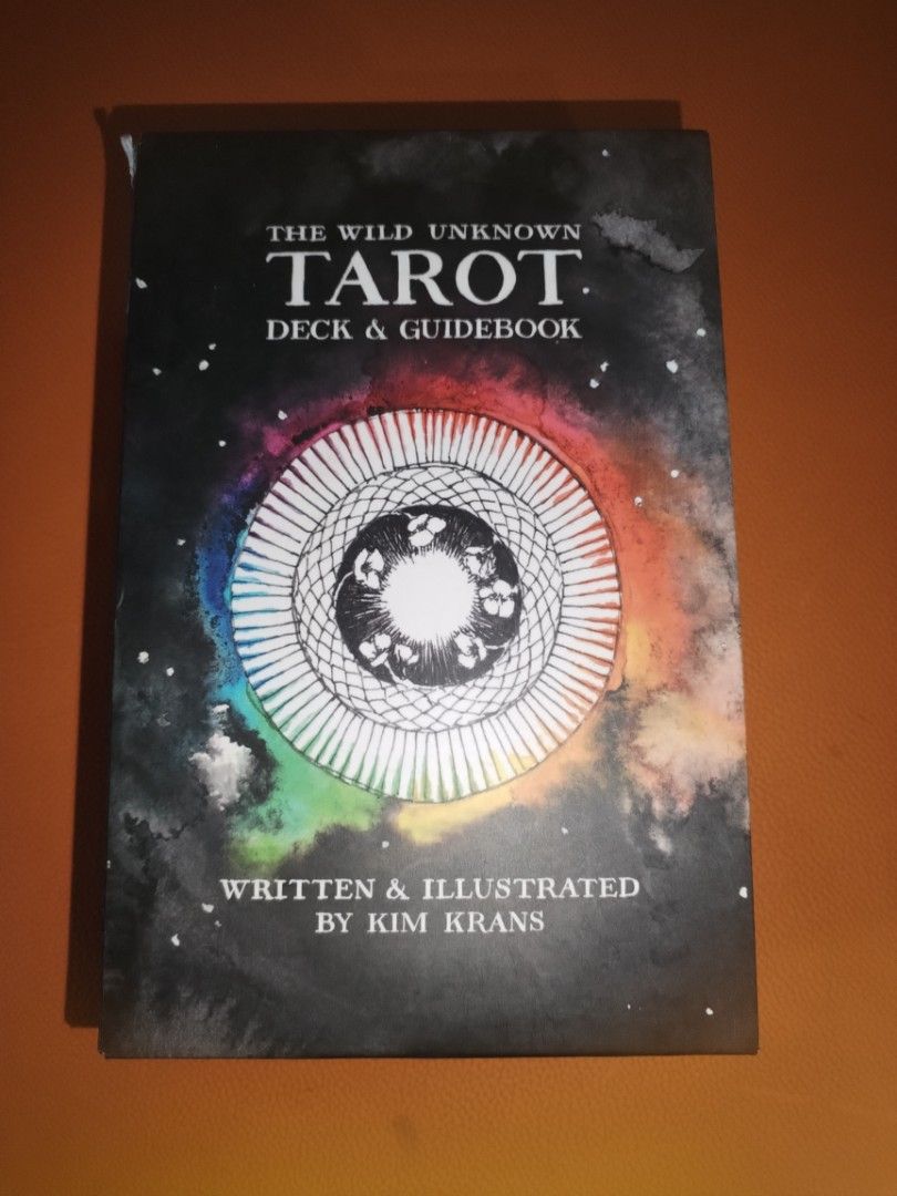The Wild Unknown Tarot Deck and Guidebook by Kim Krans (Category: Storybooks) located in Manila. Submitted by archtypeenthusiast (Listing ID 1466397559, Image 1). Description: Popular tarot deck by Kim Krans. Includes the complete deck of cards plus the matching guidebook. Outer box has artwork featuring a rainbow circle against a starry night background. Great tool for daily readings, meditation, or learning cartomancy. All original contents inc