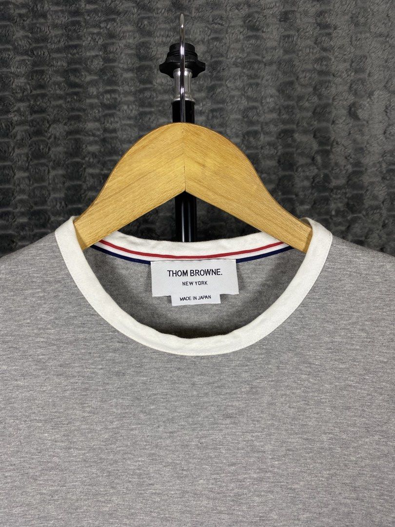 Thom Browne Contrast Trim Ringer Shirt (Category: Shirts) located in Bacolod City. Submitted by treasurehunts.6100 (Listing ID 1466387009, Image 2). Description: Thom Browne Contrast Trim Ringer Shirt Condition - Excellent Color - Grey, White Color rate - 9.8 / 10 No Flaws Size 1 Dimensions : Width - 16.5 Length - 22 Front, 23 Back Brands you might find on my profile : ( Cos, Uniqlo, H&M, Zara, Muji, Ralph Lauren, Hugo Boss, Fred Perry, Lacoste, 