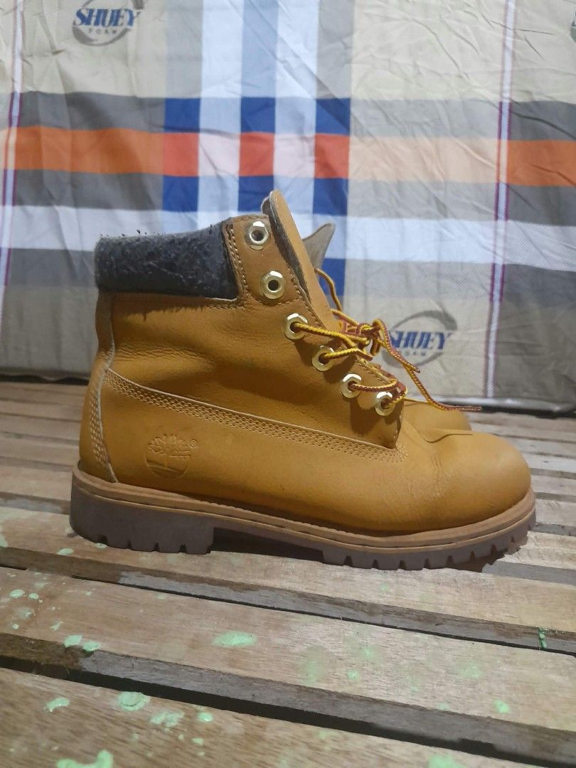 Timberland Boots EUR 38 (Category: Boots) located in Butuan. Submitted by johnraven086338 (Listing ID 1466519574, Image 2). Description: - Authentic Timberland wheat nubuck leather boots - Traditional lace-up front with iconic red and yellow striped laces - Comfortable padded grey ankle collar - Heavy-duty lug sole for superior grip and durability - Classic embossed tree logo on the side - Interior fabric lining shows normal, expected wear - Stam