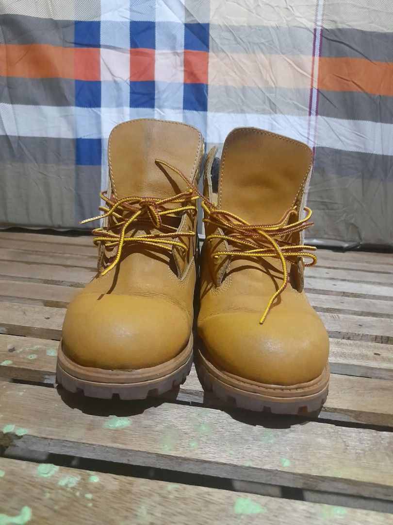 Timberland Boots EUR 38 (Category: Boots) located in Butuan. Submitted by johnraven086338 (Listing ID 1466519574, Image 3). Description: - Authentic Timberland wheat nubuck leather boots - Traditional lace-up front with iconic red and yellow striped laces - Comfortable padded grey ankle collar - Heavy-duty lug sole for superior grip and durability - Classic embossed tree logo on the side - Interior fabric lining shows normal, expected wear - Stam