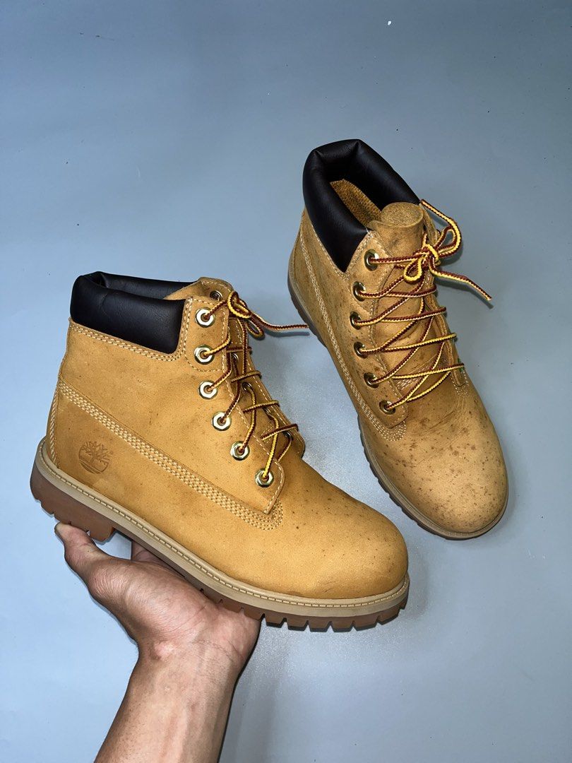 Timberland Premium 6-Inch Waterproof Boots (Category: Boots) located in Lala. Submitted by adrian.885 (Listing ID 1466524203, Image 1). Description: Timberland Premium 6-Inch Waterproof Boots in the wheat colorway, featuring a distinctive nubuck leather upper, black padded collar, and rubber lug outsoles..