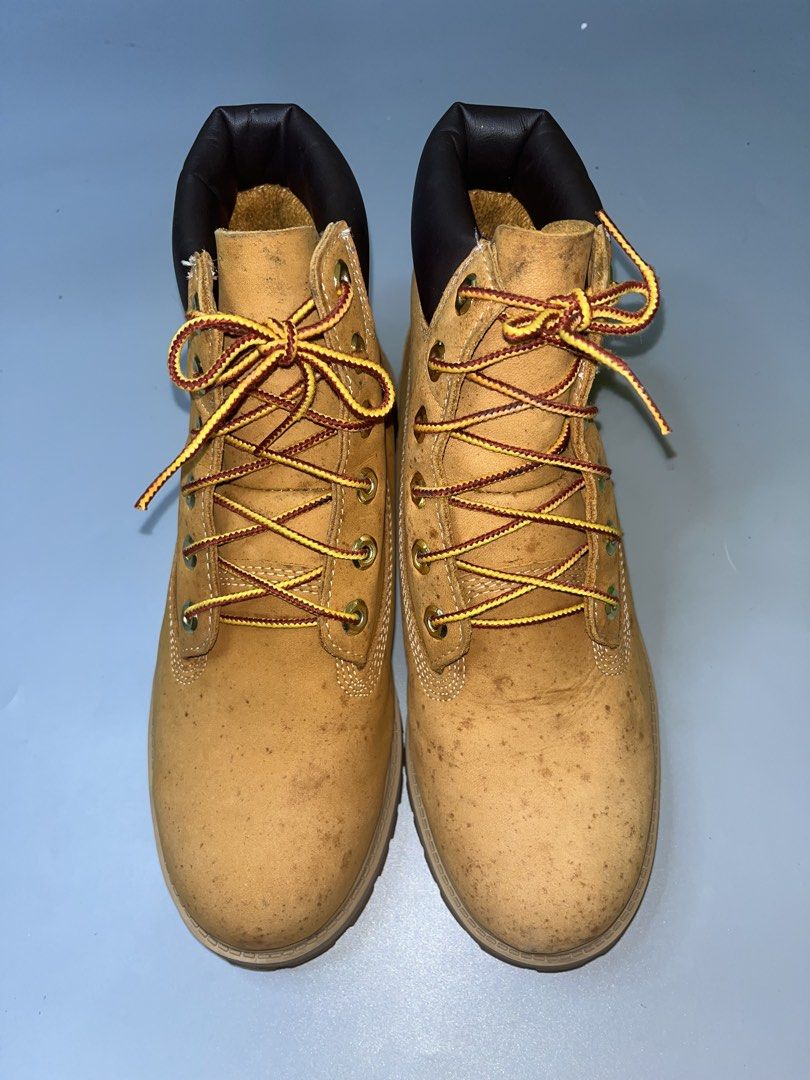 Timberland Premium 6-Inch Waterproof Boots (Category: Boots) located in Lala. Submitted by adrian.885 (Listing ID 1466524203, Image 2). Description: Timberland Premium 6-Inch Waterproof Boots in the wheat colorway, featuring a distinctive nubuck leather upper, black padded collar, and rubber lug outsoles..