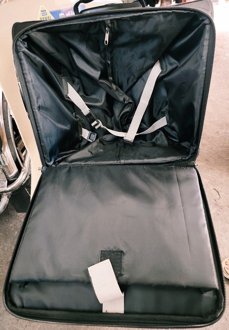 Time Black Rolling Luggage Trolley Suitcase (Category: Luggage) located in Bulacan. Submitted by gelvy1316 (Listing ID 1466371674, Image 3). Description: - Brand: Time - Color: Classic Black - Mobility: Retractable dual metal top handle and smooth rolling wheels - Exterior: Front zipped compartments for quick-access items - Main Interior: Cross-straps to keep clothes secure and organized - Tech-Friendly: Separate padded section with velcro strap 