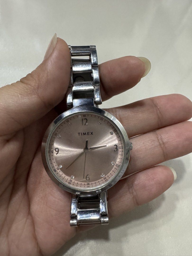 Timex Watch (Category: Women's Watches) located in Cagayan de Oro. Submitted by serenexsienna (Listing ID 1466456827, Image 1). Description: ✅Timex Women’s Watch Rose Gold Dial Stainless Steel ✅Brand: Timex Women's Watch ✅Dial: Rose gold sunburst with crystal markers and Arabic numerals at 12, 3, 6, and 9 ✅Strap: Two-tone compatible silver-tone metal link bracelet ✅Movement: Battery-powered quartz ✅Durability: Stainless steel case back, water res
