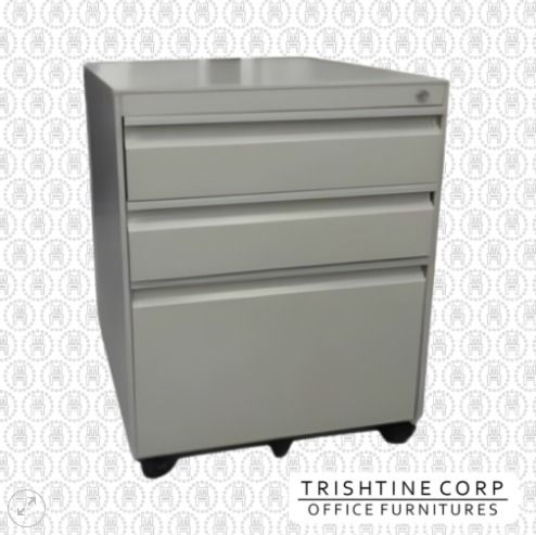 TMP-039 | All Steel 3-Drawer Mobile Pedestal (Category: Office Furniture & Fixtures) located in Caloocan City. Submitted by jim.trishtineofficefurnitures (Listing ID 1466417499, Image 1). Description: - Brand: Trishtine Corp Office Furniture - Color/Finish: Light grey - Material: Heavy-duty metal construction - Storage: 3 drawers total (2 standard utility drawers and 1 deep file drawer) - Security: Lock mechanism on top right corner - Mobility: 4