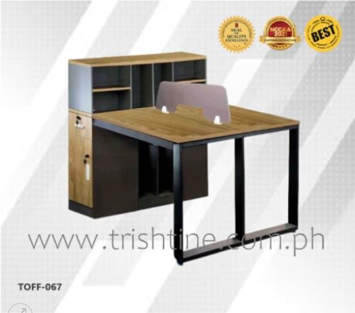 TOFF-067 | 2 seater Office Table with Side Drawer and Shelf (Category: Office Furniture & Fixtures) located in Caloocan City. Submitted by jim.trishtineofficefurnitures (Listing ID 1466423742, Image 1). Description: - Brand/Model: Trish Tine TOFF-067 Double Workstation - Design: Shared wood-grain surface with stylish dark grey and black accents - Frame: Sturdy black metal frame with a center frosted privacy divider - Storage: Attached side cabine