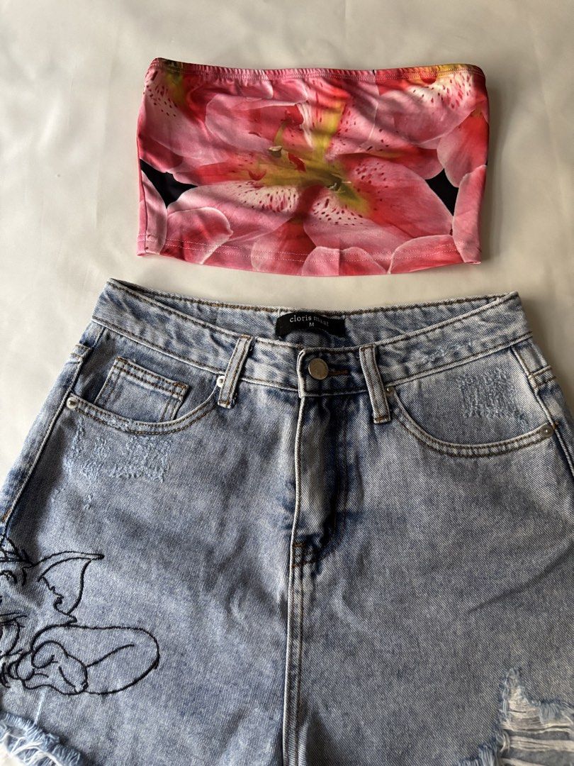 Tom & Jerry Denim Shorts (Category: Sets or Coordinates) located in Manila. Submitted by mpt99876 (Listing ID 1466517062, Image 2). Description: - Set includes: Pink floral print tube top and light wash denim shorts - Shorts details: Embroidered Tom and Jerry graphic, raw frayed hems, and distressed detailing - Brand & Size: Cloris Maat, Size M - Versatile: Perfect for summer days, casual hangouts, and festivals; easy to mix and match.